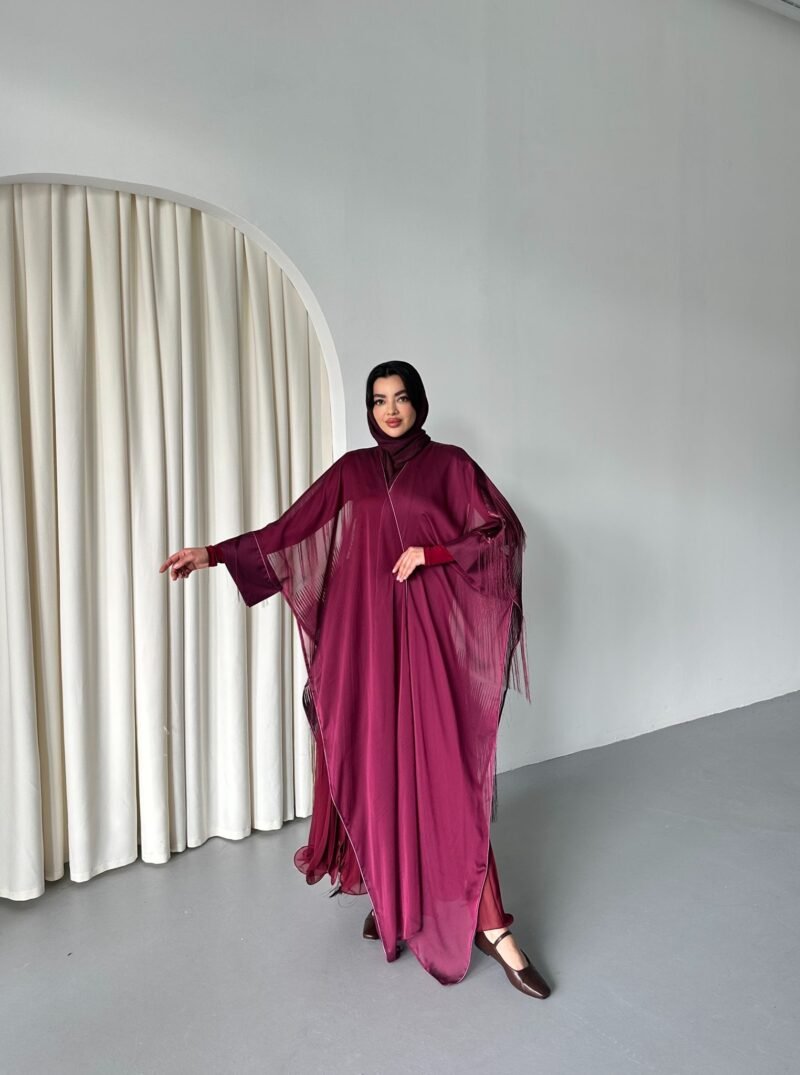 Abaya (Burgundy) one of the beautiful collections, featuring a very soft fabric and a cloche cut with a pleated opening on the back. It is considered an elegant and practical abaya at the same time