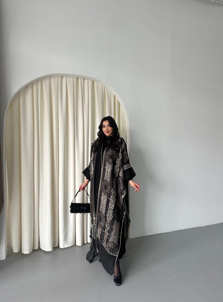 Gold Abaya with luxurious and shiny fabric and features a full Bisht cut. The Abaya comes with a matching Shayla,The fabric is Chiffon with handmade embroidery, which makes it comfortable to wear all day long